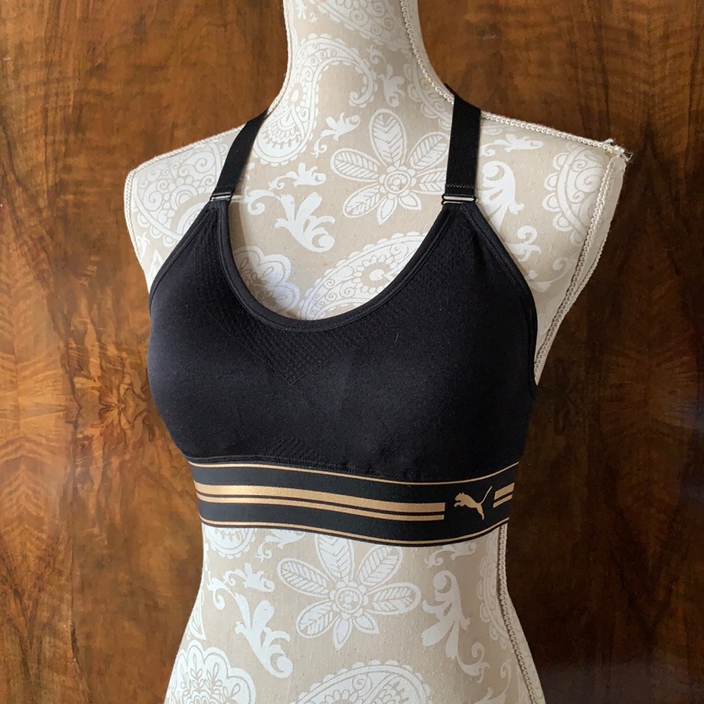 New without tags black/gold size M Puma sports bra